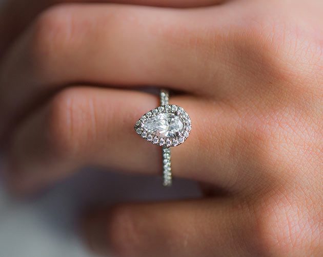 Halo And Shank Diamond Engagement Ring on hand