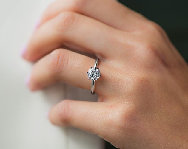 Solitaire setting diamond ring